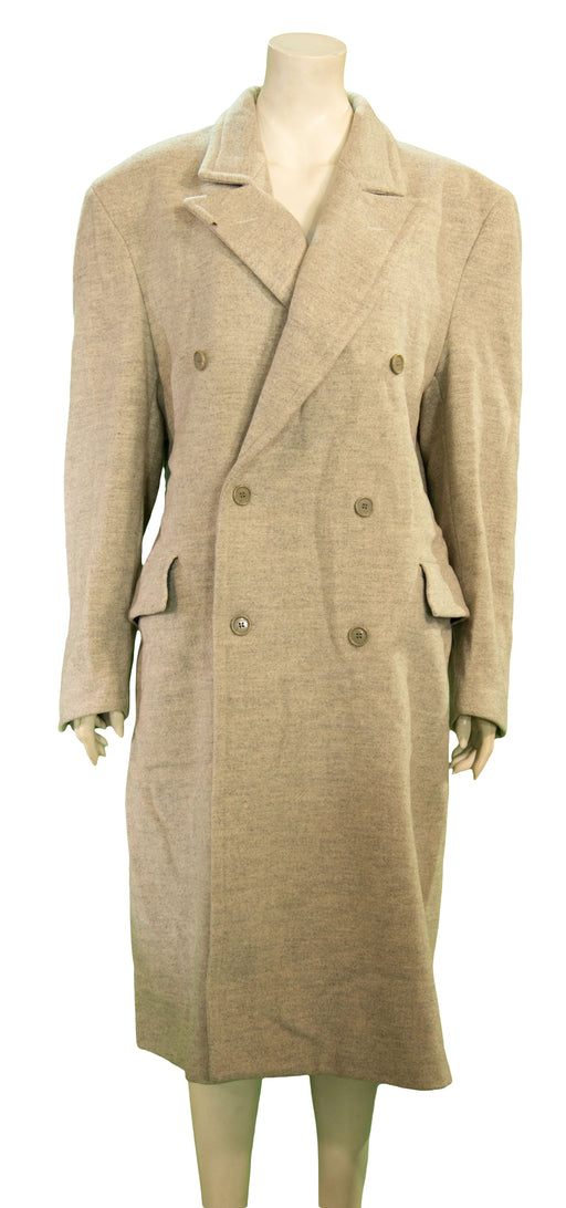 Beige double-breasted wool coat with wide lapels and side pockets on a mannequin