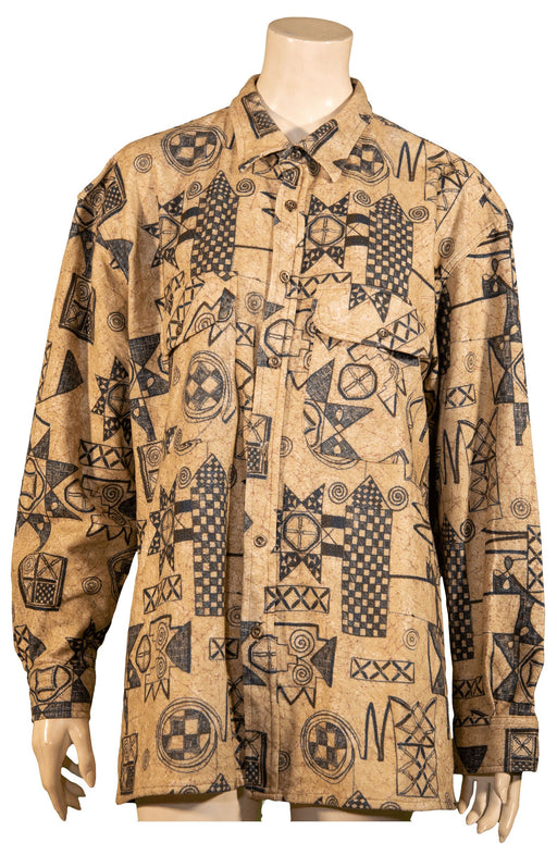 Beige long-sleeve shirt with black tribal and geometric patterns displayed on a mannequin.