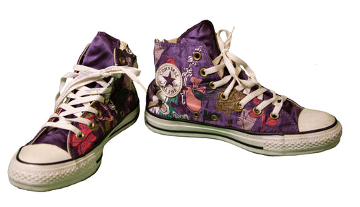 Purple Converse high-top sneakers with a colorful artistic design and white laces